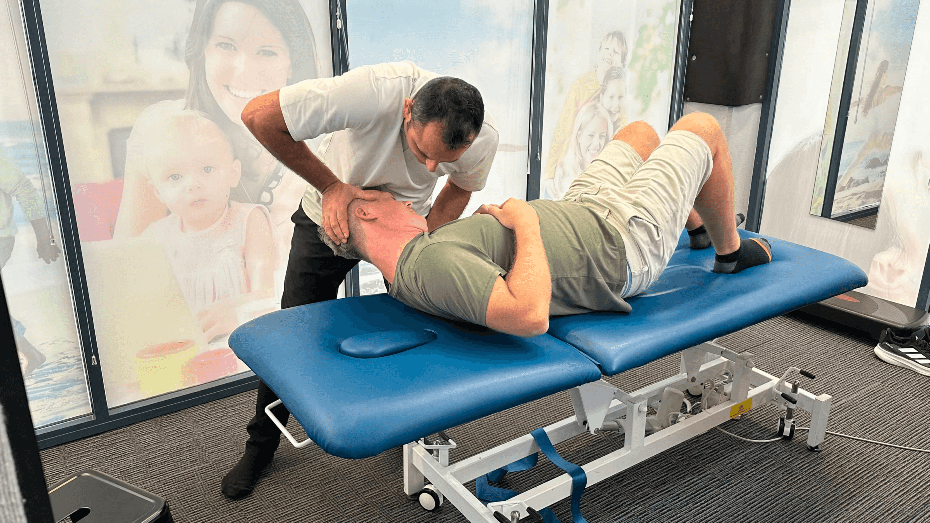 Chiropractor performing adjustment on patient at Complete Chiropractic Dee Why
